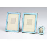 A pair of silver and blue enamel easel photograph frames, London 1923 9cm x 4cm together with a blue