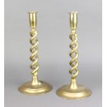 A pair of 19th Century brass spiral turned candlesticks 31cm h