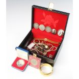 A jewellery box containing a 1977 silver proof Silver Jubilee crown, 3 American silver dollars 1888,