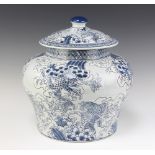 A Chinese blue and white urn and cover of squat form, decorated carp 37cm x 34cm