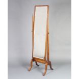 A 1930's rectangular bevelled plate cheval mirror contained in an oak swing frame 159cm h x 47cm 2 x