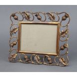 An Art Nouveau pierced gilt metal easel photograph frame decorated thistles, the reverse marked D.