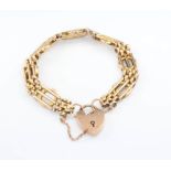 A 9ct yellow gold gate bracelet with heart locket, 15.4 grams