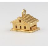 An 18ct yellow gold chalet charm, 2.5 grams
