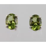 A pair of peridot ear studs