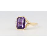 An 18ct yellow gold amethyst and diamond ring, size P