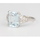 A platinum aquamarine and diamond ring, centre stone approx. 3.25ct surrounded by brilliant cut