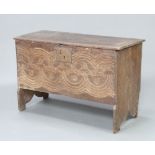 A 17th/18th Century oak coffer of plank construction with iron lock plate, carved decoration to