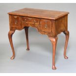 A Queen Anne style walnut side table with quarter veneered top fitted 1 long and 2 short drawers,