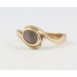 A 9ct yellow gold mother of pearl ring, size L, 2.9 grams