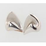 A pair of 9ct white gold scroll ear studs 2.4 grams1 butterfly is missing