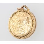 A 9ct yellow gold engraved circular locket, 7.3 grams