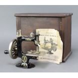A Singer no.20 manual sewing machine complete with instructions and case, table clamp missing?