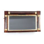 A 19th Century rectangular plate over mantel mirror contained in a rosewood frame with column
