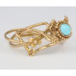 An 18ct yellow gold turquoise puzzle ring, size M, 6.3 grams