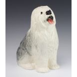 A Beswick figure of a seated Old English Sheep Dog, base with rubber stamp mark 29cm