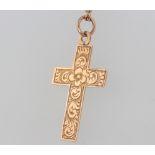 A 9ct yellow gold cross pendant and chain, 3 grams