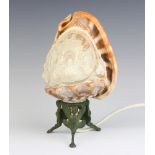 A table lamp formed from a carved conch shell raised on a gilt metal base 21cm h x 12cm x 9cm