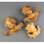 Two 18th Century style carved lime wood busts of cherubs 13cm x 14cm and 1 other 10cm x 6cm
