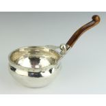 A Continental planished sterling silver brandy saucepan with carved wooden handle, base marked