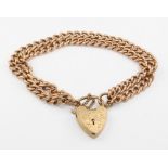 A 9ct yellow gold double strand bracelet and heart padlock 25.6 grams