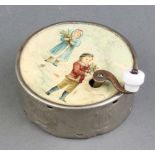 A 19th Century metal musical box of circular form, the paper top decorated Children, the base marked