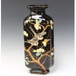 A Victorian Art Nouveau black glazed and floral patterned vase decorated birds amongst branches 46cm