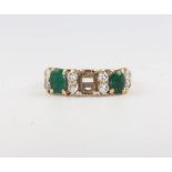 A 14ct yellow gold emerald and diamond ring, 2.6 grams, size O 1 emerald is missing