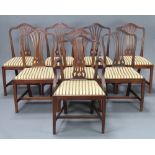 A set of 8 Hepplewhite style mahogany camel back dining chairs - 1 carver, 7 standard with