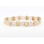 A 9ct yellow gold diamond set bracelet 11.2 grams, 8cm