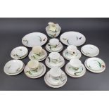 A Victorian 33 piece porcelain tea service with butterfly decoration comprising 2 bread plates, 11