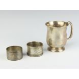 A silver christening tankard Sheffield 1936 together with 2 silver napkin rings of plain form, 152