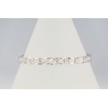 An 18ct white gold princess cut diamond tennis bracelet, 4ct