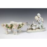 A Meissen style boat shaped ribbon ware floral encrusted basket supported by cherubs 15cm x 32cm x