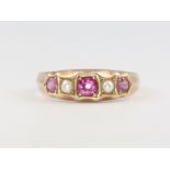 A 9ct yellow gold ruby and pearl ring, size N, 2.1 grams
