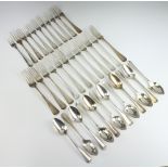 A Continental silver Old English pattern table service comprising 12 dessert spoons, 11 dessert