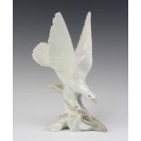 A Lladro figure of a diving dove impressed Lladro Made in Spain 3 28cm There is some crazing to