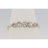 An 18ct yellow gold 5 stone diamond ring, size P, 2.3 grams