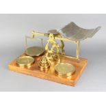 S Mordan & Co. London, a pair of brass postage scales raised on a mahogany stand together with 7