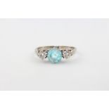 An 18ct yellow gold blue zircon and diamond ring, size O, 2.8 grams