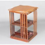 An Edwardian square shaped "revolving" 2 tier bookcase the top with inlay 66cm h x 51cm w x 50cm d