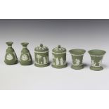 A pair of Wedgwood green Jasperware vases marked 72 9cm, pair of ditto jars and covers 9cm and 2
