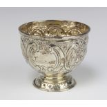 An Edwardian circular embossed silver sugar bowl with armorial decoration London 1902, 125 grams