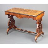 A Victorian inlaid figured walnut centre table, raised on pierced standard end supports with H