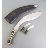 A Kukri with horn grip, 2 skinning knives and scabbard