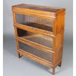 An oak 3 section Globe Wernicke style bookcase 106cm h x 86cm w x 28cm d Some light water marks to