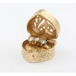 A 9ct yellow gold heart shaped box charm, 4.7 grams