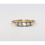 An 18ct yellow gold 5 stone diamond ring, size W, 2 grams