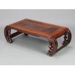A Chinese rectangular hardwood opium table, raised on pierced scroll supports 31cm h x 99cm l x 47cm