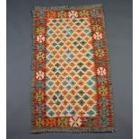 A white, turquoise and green ground Chobi Kilim rug 128cm x 71cm